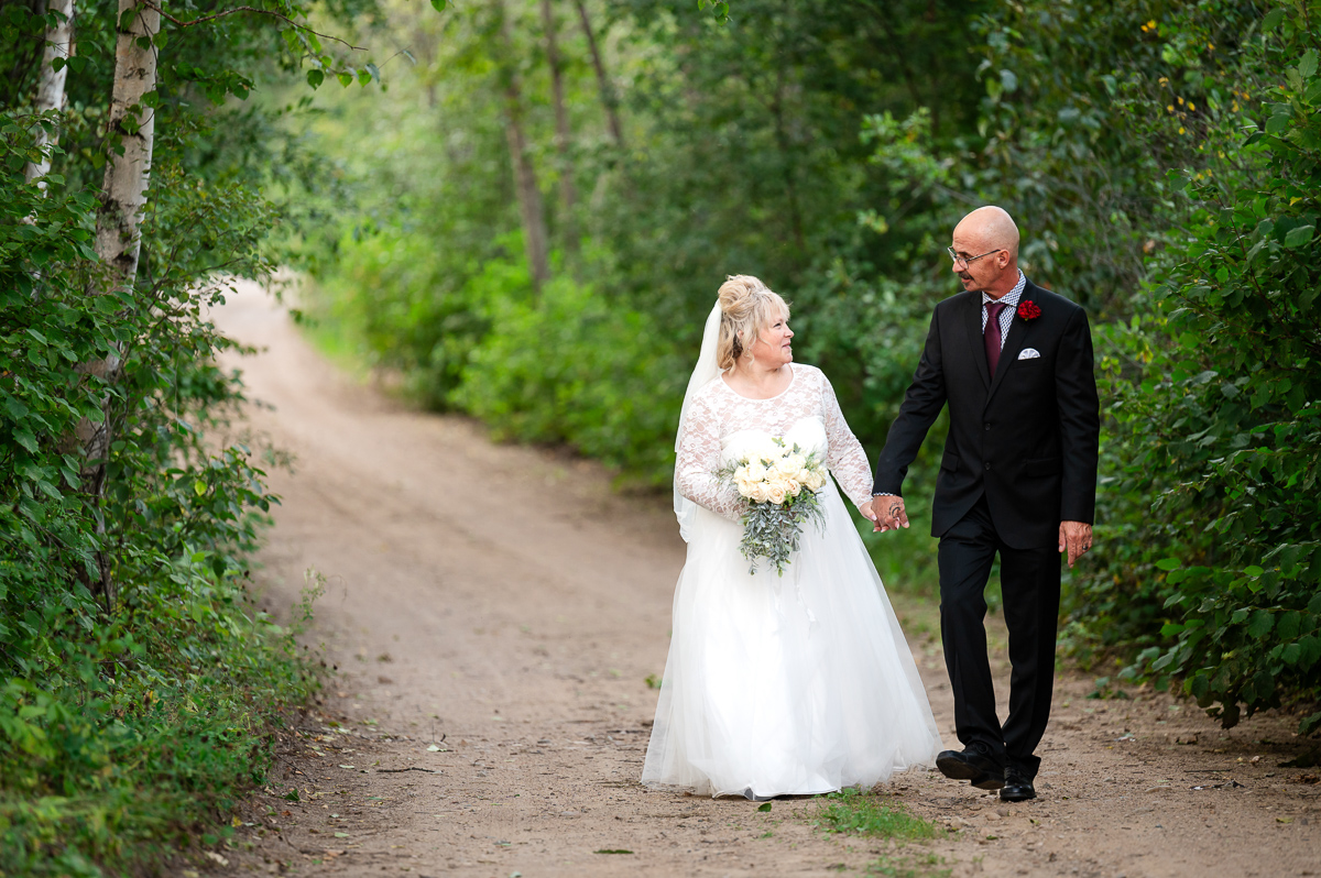 Forrest elopement, sunset session, sunset wedding, bridge marriage, bride and groom, wedding photographer, walking down the road, bride and groom, 