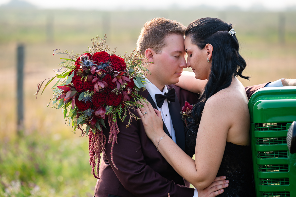 Landry lake ranch, horse wedding, black wedding dress wedding, photographer near me, John deer tractor, flowers by above, wedding bouquet, 