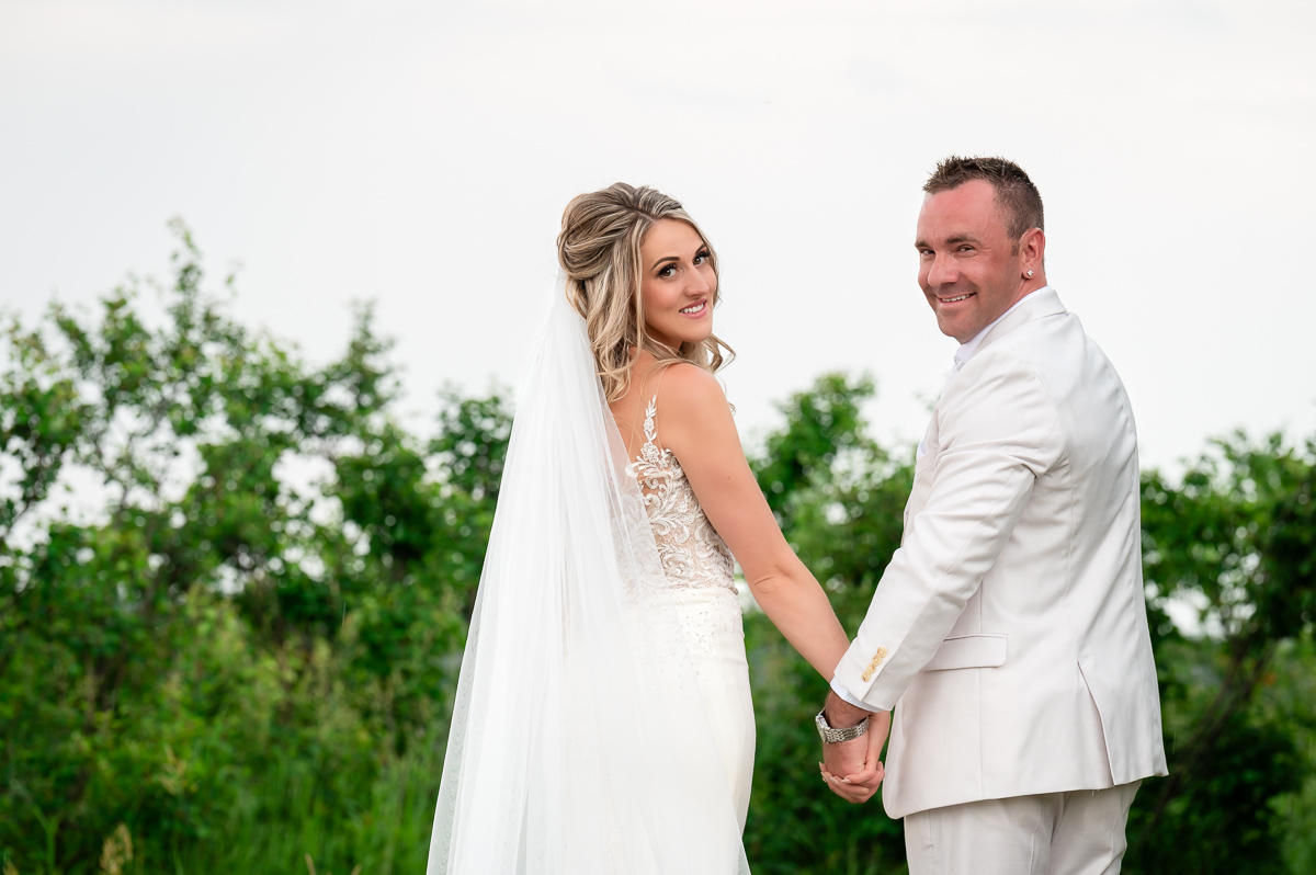 bride and groom looking back, posing ideas, franchere bay campground, beach wedding, posing ideas, photographer near me,